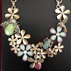 St. Thomas necklace with bejeweled flowers